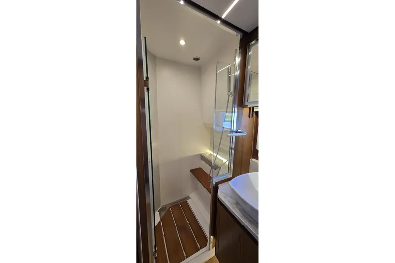 Jack's Boat Yacht Photos Pics Luxurious bathroom interior of 2024 Tiara Yachts EX 60 with modern shower design.