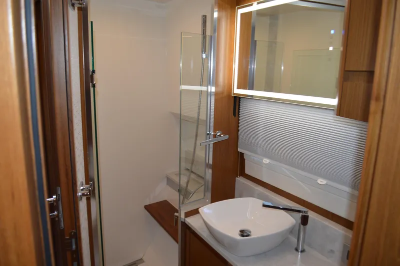 Jack's Boat Yacht Photos Pics Luxurious bathroom interior of 2024 Tiara Yachts EX 60 with modern fixtures and elegant design.