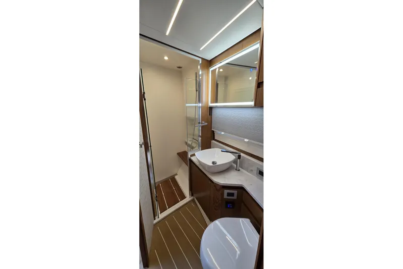 Jack's Boat Yacht Photos Pics Luxurious bathroom in 2024 Tiara Yachts EX 60, featuring modern fixtures and elegant design.