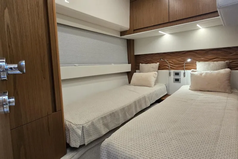Jack's Boat Yacht Photos Pics 2024 Tiara Yachts EX 60 interior cabin with twin beds and modern design.