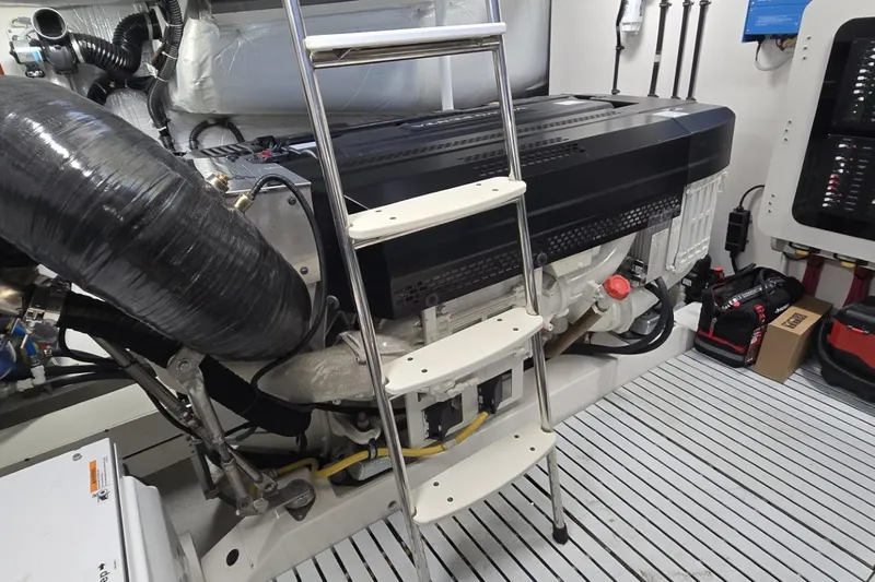 Jack's Boat Yacht Photos Pics Engine room of 2024 Tiara Yachts EX 60 with ladder and equipment.