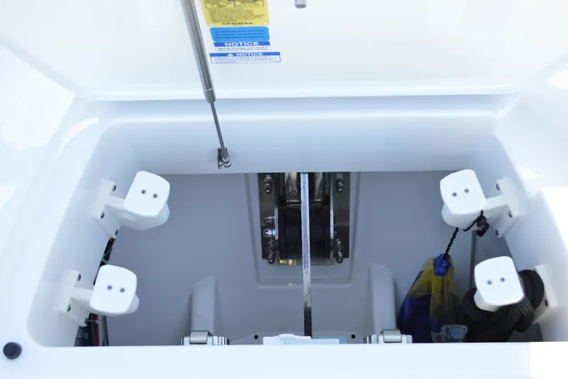 Jack's Boat Yacht Photos Pics Storage compartment of 2024 Tiara Yachts EX 60, featuring organized equipment holders.