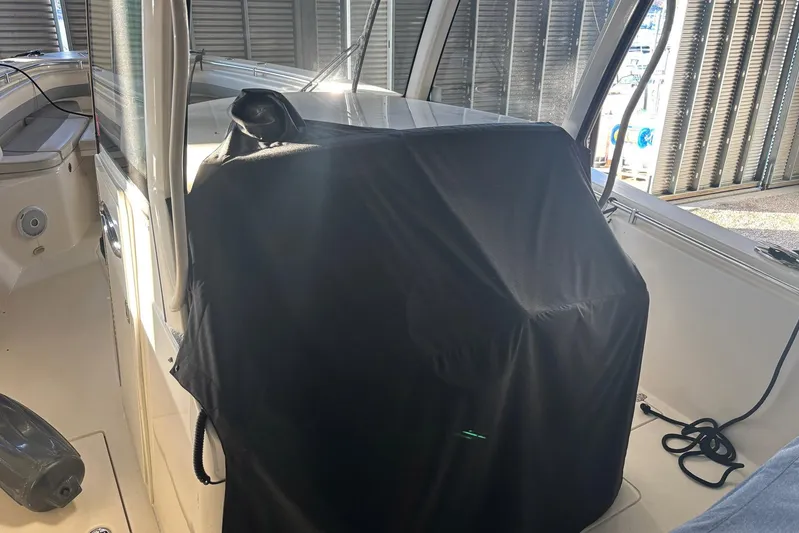 Pier Pressure Yacht Photos Pics 2018 Cobia 344 Center Console interior with covered console and seating area.