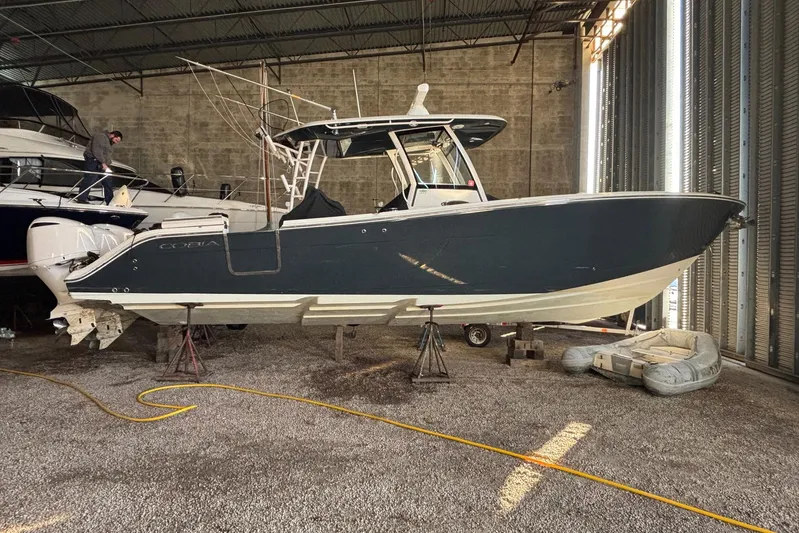 Pier Pressure Yacht Photos Pics 2018 Cobia 344 Center Console boat in storage, elevated on stands.