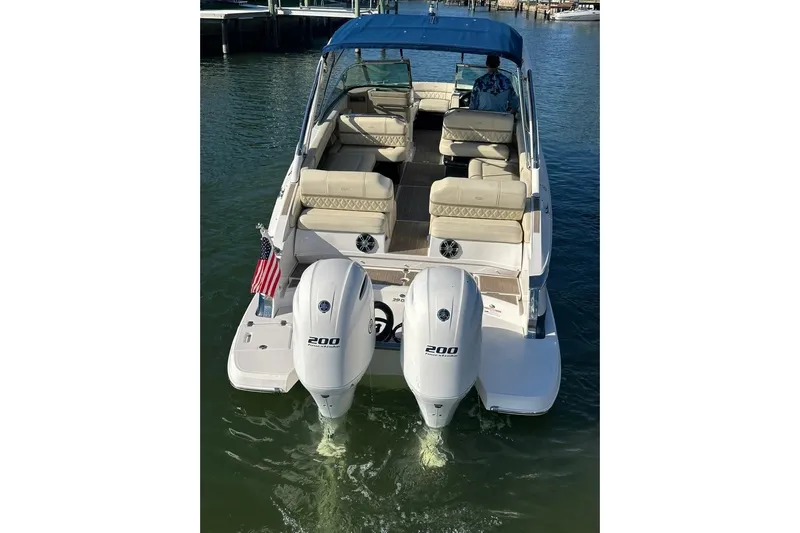  Yacht Photos Pics 2019 Regal 29 OBX boat with dual outboard engines on water.