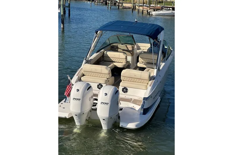  Yacht Photos Pics 2019 Regal 29 OBX boat with dual engines, docked on calm water.