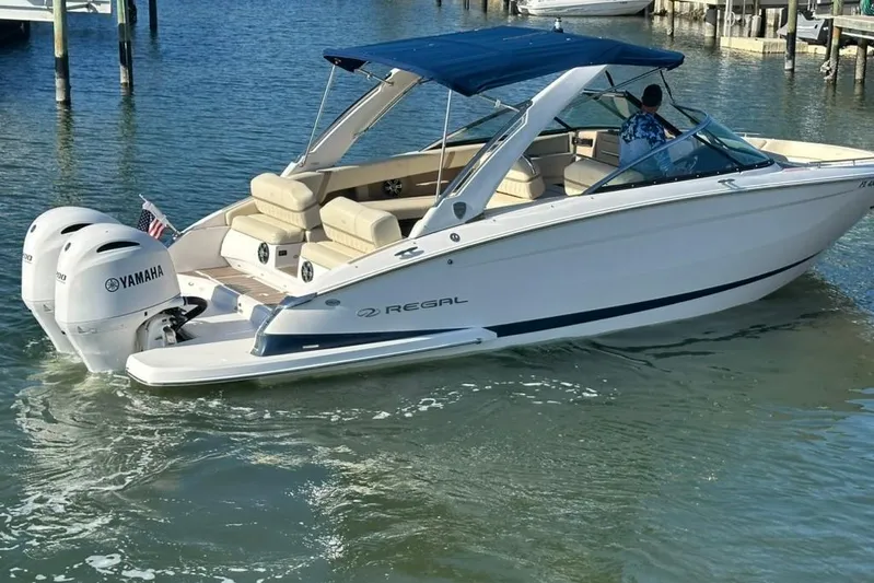  Yacht Photos Pics 2019 Regal 29 OBX boat with Yamaha engines on water, featuring a blue canopy.