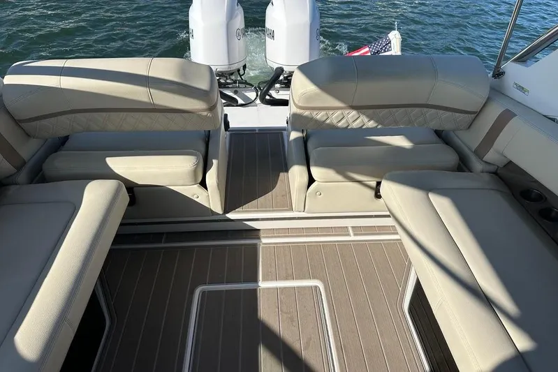  Yacht Photos Pics 2019 Regal 29 OBX boat interior with beige seating and twin Yamaha engines.
