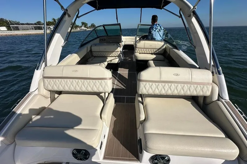  Yacht Photos Pics 2019 Regal 29 OBX boat interior with luxurious seating on open water.