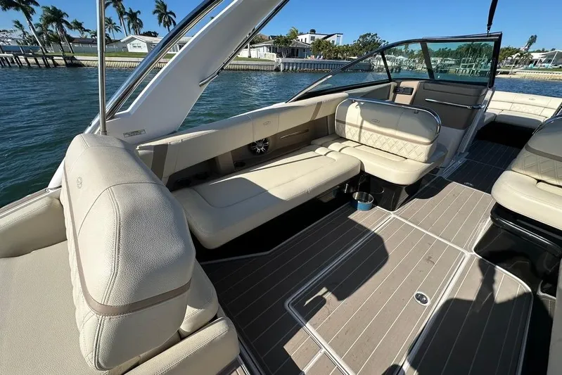  Yacht Photos Pics Luxurious interior of 2019 Regal 29 OBX boat with beige seating and sleek design.