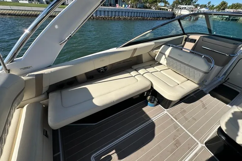  Yacht Photos Pics Luxurious interior of 2019 Regal 29 OBX boat with beige seating and sleek design.