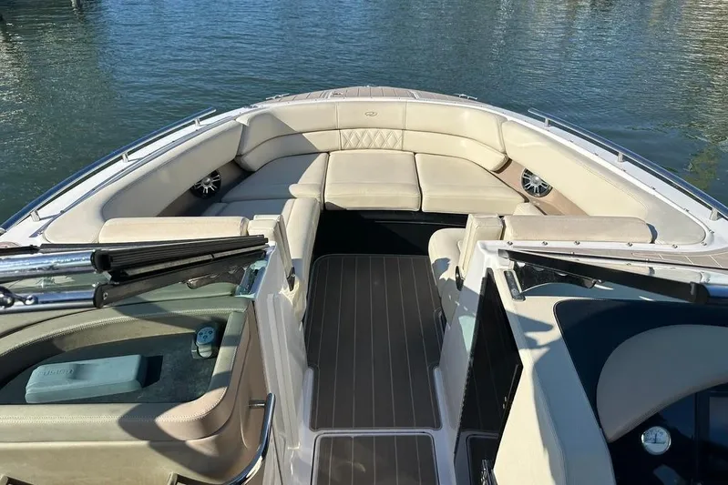  Yacht Photos Pics 2019 Regal 29 OBX boat interior with spacious seating and elegant design on the water.
