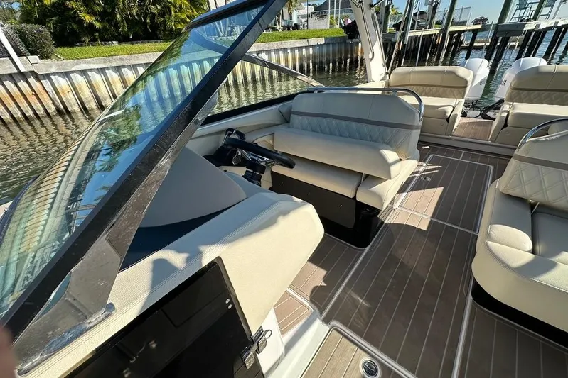  Yacht Photos Pics 2019 Regal 29 OBX boat interior with beige seating and sleek design.