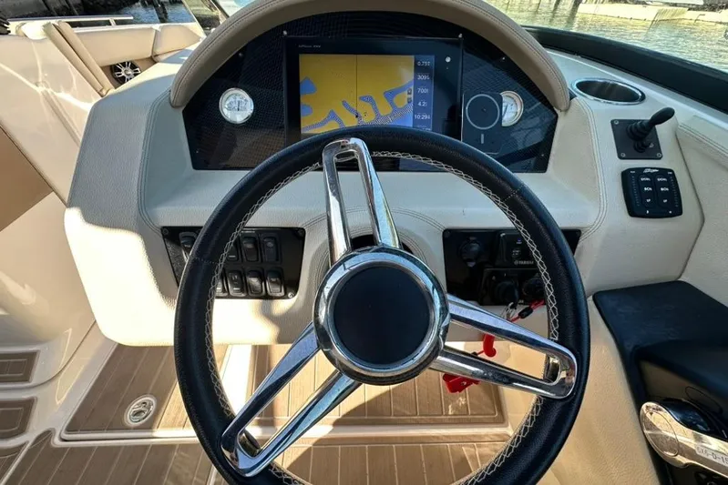 Yacht Photos Pics 2019 Regal 29 OBX boat dashboard with steering wheel and navigation display.
