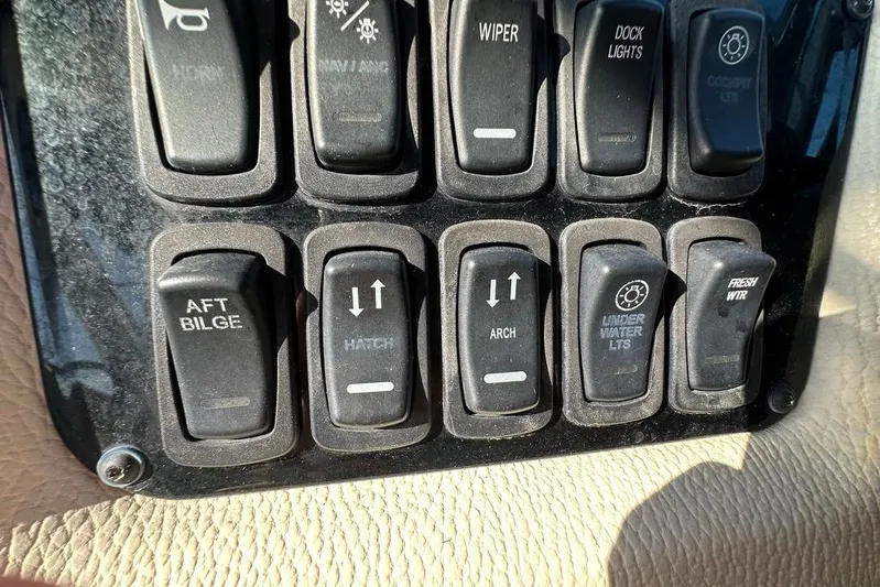  Yacht Photos Pics Control panel switches on a 2019 Regal 29 OBX boat dashboard.