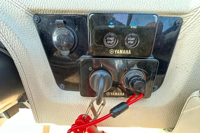  Yacht Photos Pics Control panel of a 2019 Regal 29 OBX boat with Yamaha start-stop buttons.
