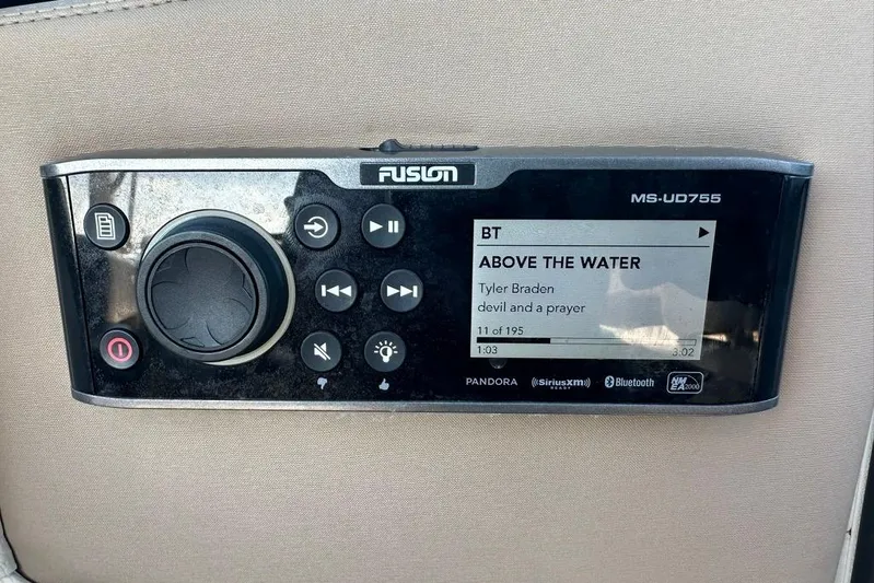  Yacht Photos Pics Fusion MS-UD755 stereo system on 2019 Regal 29 OBX boat, displaying music track details.