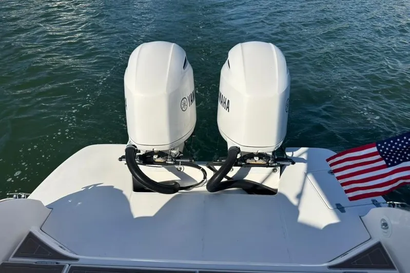  Yacht Photos Pics 2019 Regal 29 OBX boat with twin Yamaha outboard engines and American flag.