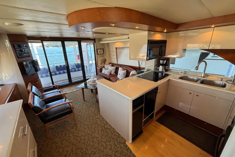 Tahoe Yacht Photos Pics Luxurious 1996 Queenship yacht interior with modern kitchen and cozy seating area.