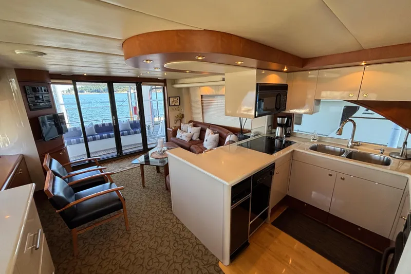 Tahoe Yacht Photos Pics Luxurious 1996 Queenship yacht interior with modern kitchen and cozy seating area.