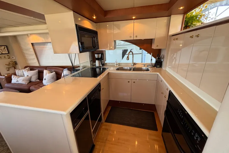Tahoe Yacht Photos Pics Luxurious 1996 Queenship yacht kitchen with modern appliances and elegant cabinetry.