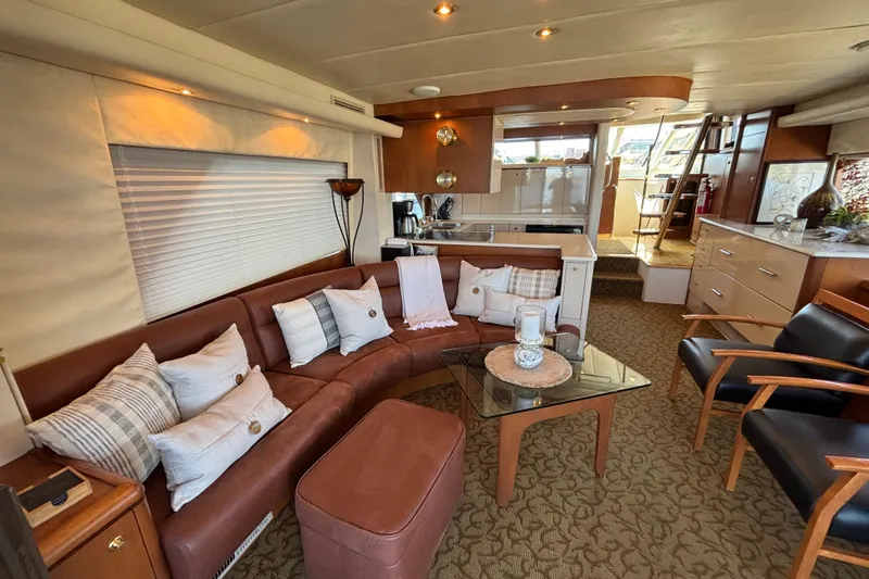 Tahoe Yacht Photos Pics Luxurious 1996 Queenship yacht interior with leather seating, modern decor, and elegant furnishings.