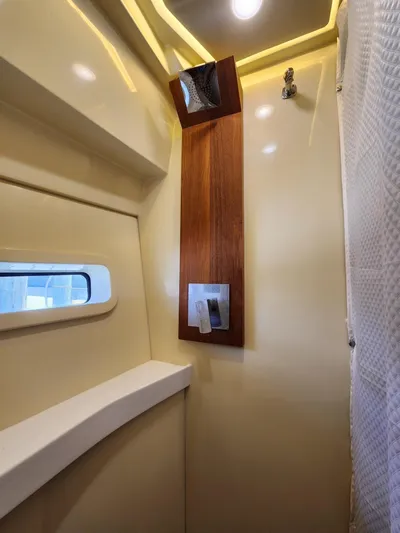 Dilligaf Yacht Photos Pics 2020 Regal 38 XO yacht interior with modern shower and window.
