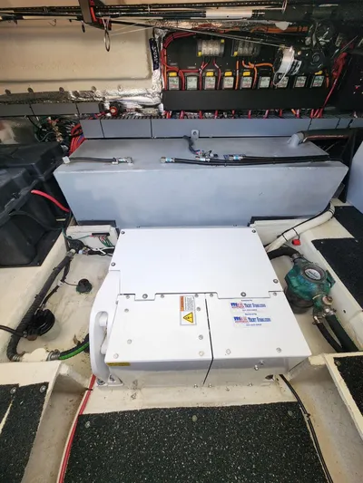 Dilligaf Yacht Photos Pics Engine compartment of a 2020 Regal 38 XO boat, showcasing mechanical components and wiring.