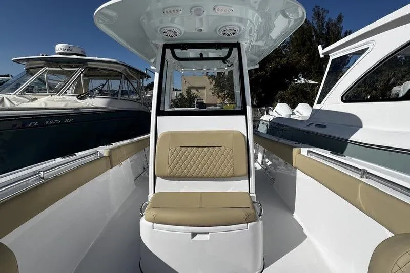  Yacht Photos Pics 2026 Sportsman Open 252 Center Console boat interior with tan seating and modern design.