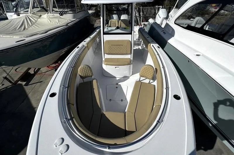  Yacht Photos Pics 2026 Sportsman Open 252 Center Console boat with tan seating and sleek design.