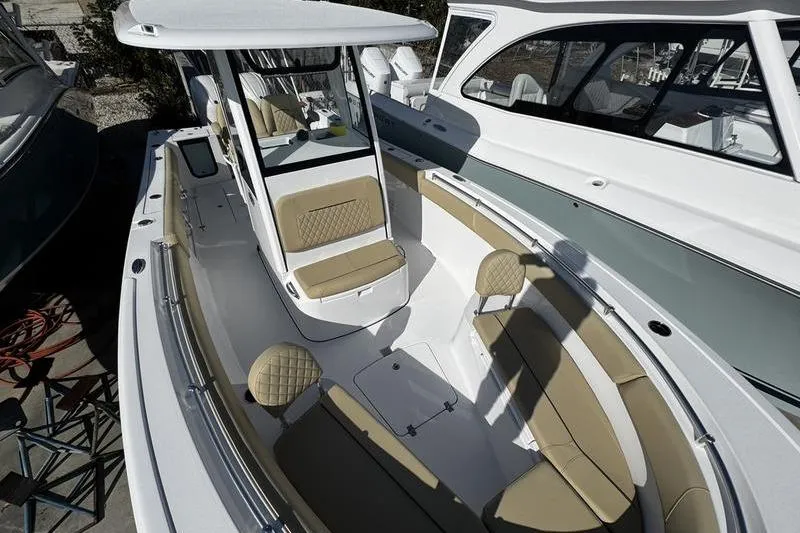 Yacht Photos Pics 2026 Sportsman Open 252 Center Console boat with tan seating and sleek design.