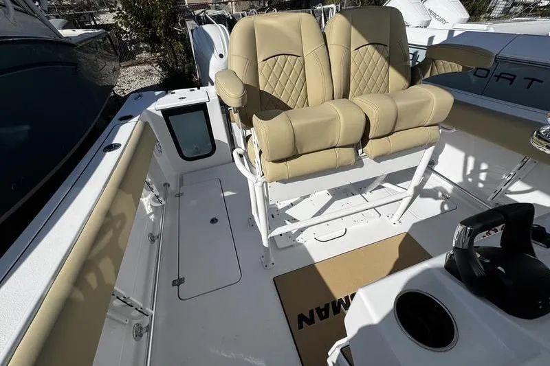  Yacht Photos Pics 2026 Sportsman Open 252 Center Console with tan seating and modern helm.
