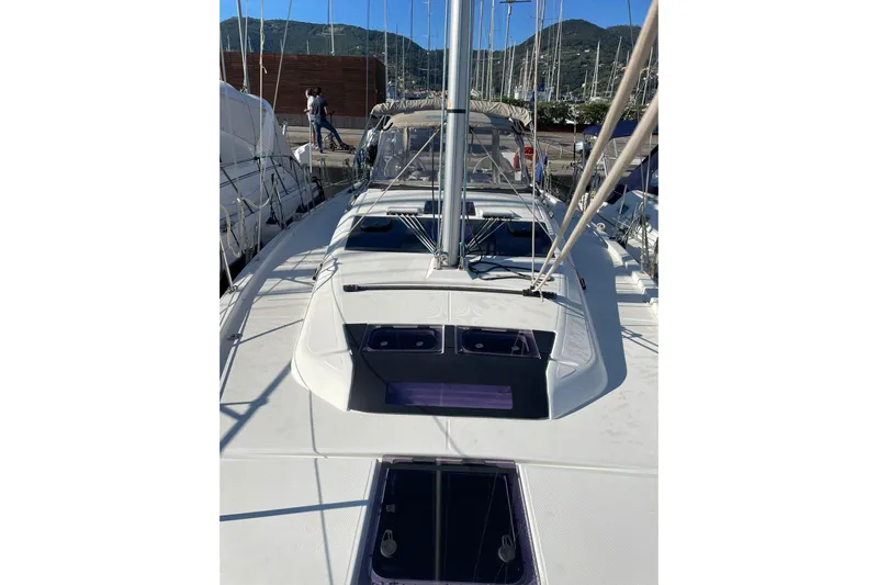  Yacht Photos Pics 2020 Dufour 390 sailboat deck view at marina, surrounded by other boats.