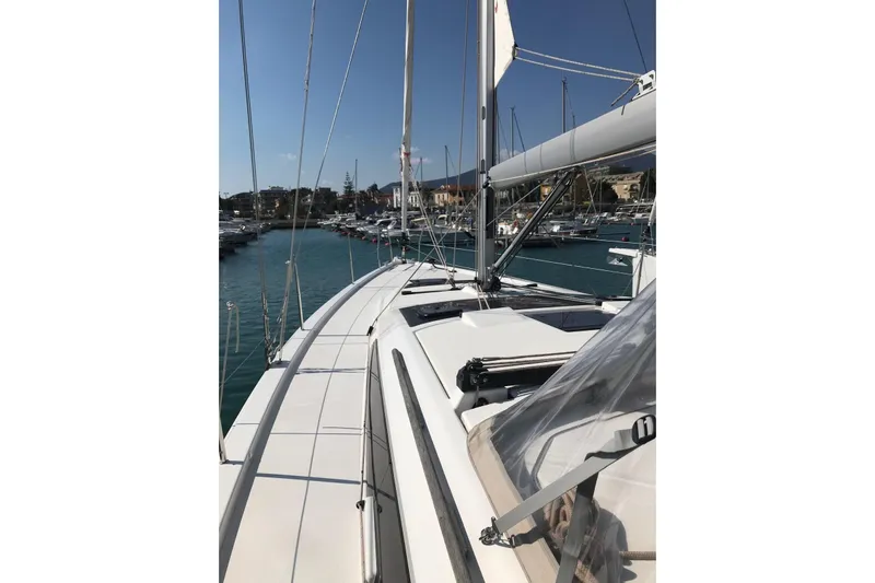  Yacht Photos Pics Dufour Yachts 390 Grand Large 2020 sailboat docked in a marina under clear skies.