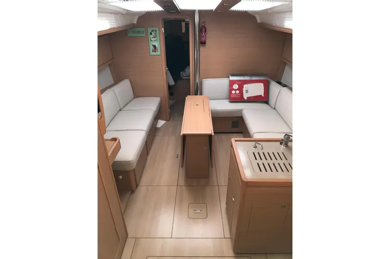  Yacht Photos Pics Interior of 2020 Dufour Yachts 390 Grand Large, featuring modern seating and kitchenette.
