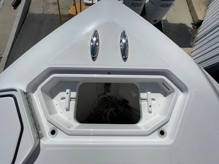 Deeper Yacht Photos Pics Invincible 39' Open Fisherman 2022 boat deck with storage compartment.