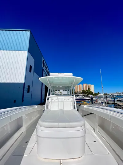 Deeper Yacht Photos Pics 2022 Invincible 39' Open Fisherman boat docked under clear blue sky.