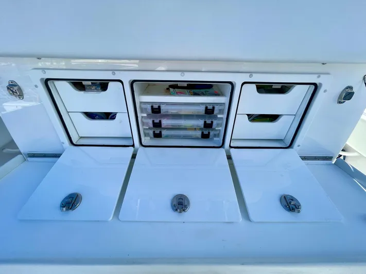 Deeper Yacht Photos Pics 2022 Invincible 39' Open Fisherman tackle storage compartments with organized drawers.