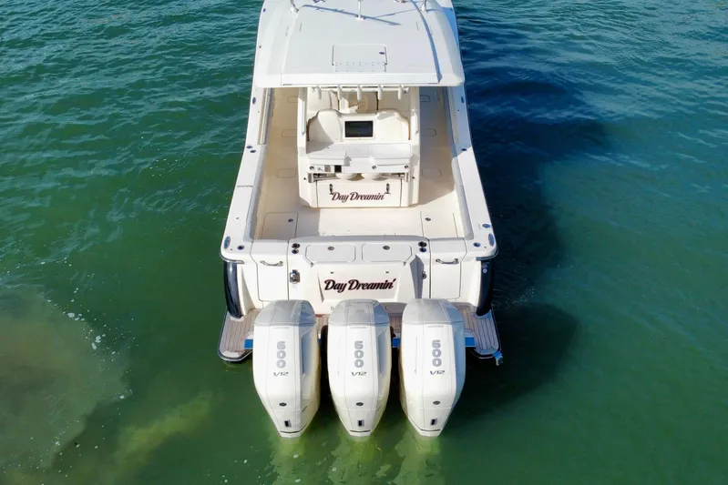  Yacht Photos Pics 2024 Scout 425 LXF boat with triple 500 V12 engines on water.