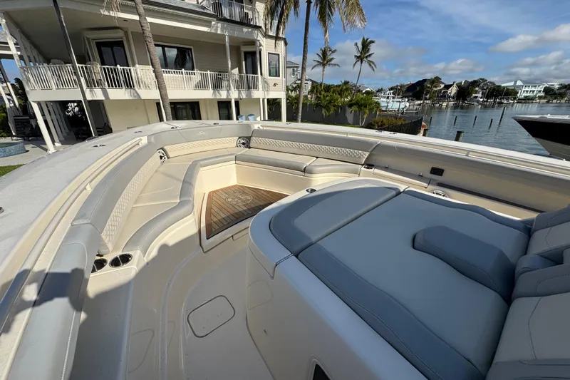  Yacht Photos Pics Luxurious 2024 Scout 425 LXF boat interior with plush seating and waterfront view.