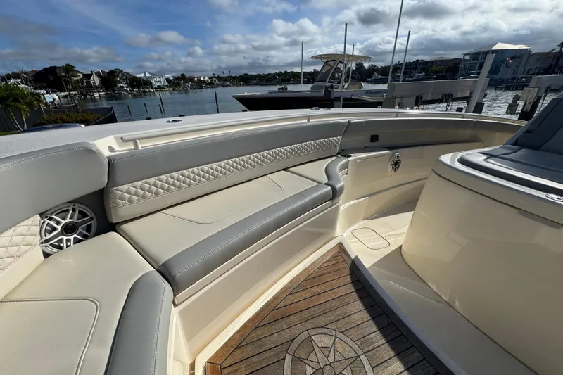  Yacht Photos Pics 2024 Scout 425 LXF boat interior with luxurious seating and waterfront view.
