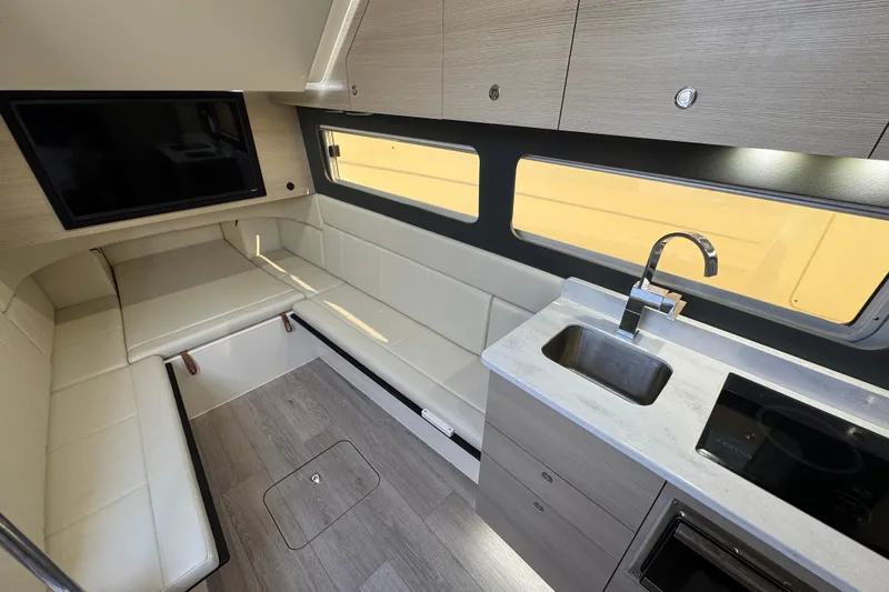  Yacht Photos Pics 2024 Scout 425 LXF interior with modern kitchen, seating, and large windows.