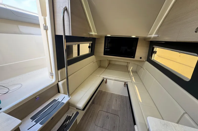  Yacht Photos Pics Luxurious interior of 2024 Scout 425 LXF boat with comfortable seating and modern amenities.