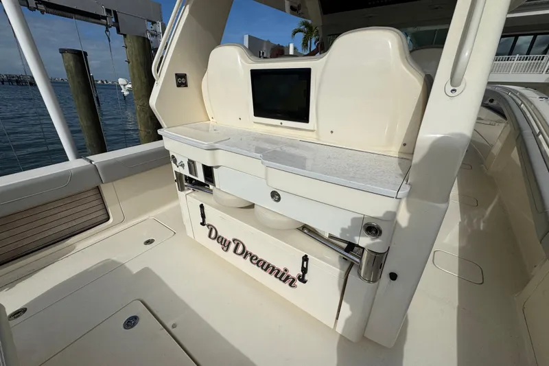  Yacht Photos Pics 2024 Scout 425 LXF boat interior with "Day Dreamin" label, docked by the water.
