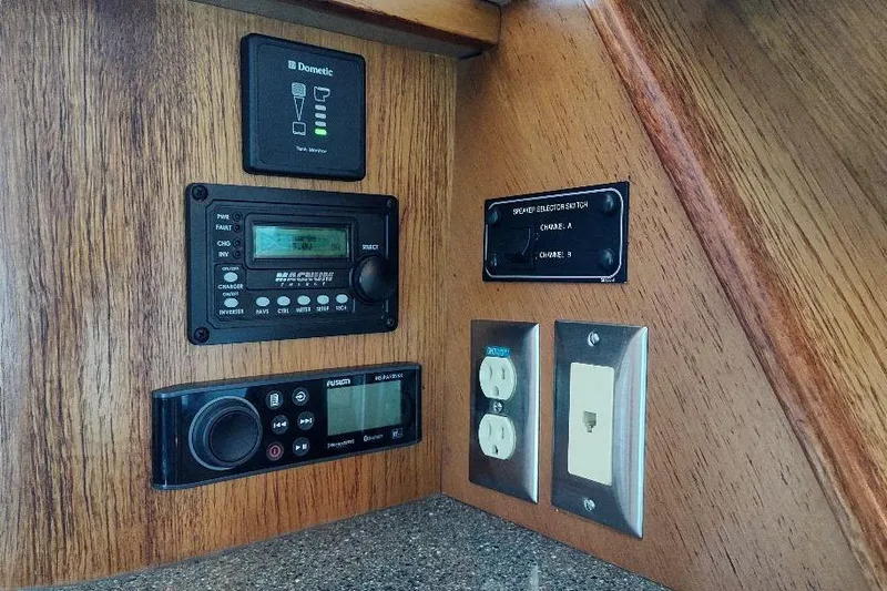 Epic Yacht Photos Pics 1998 Bayliner 4788 Pilot House Motoryacht control panel with electronic displays and outlets.