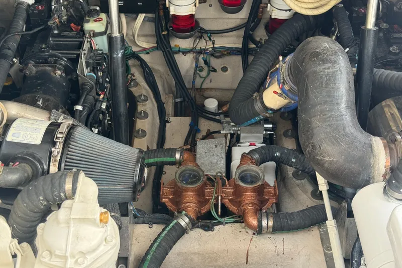 The Office Yacht Photos Pics Engine compartment of a 2011 Sea Ray 470 Sundancer boat, showcasing mechanical components.