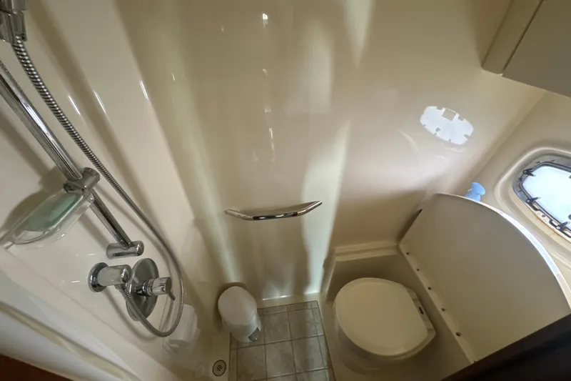 The Office Yacht Photos Pics Bathroom interior of 2011 Sea Ray 470 Sundancer yacht with shower and toilet.