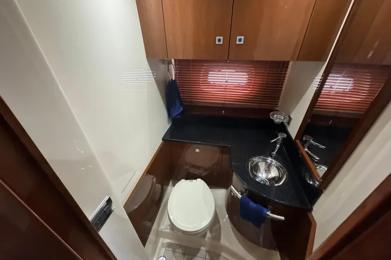 The Office Yacht Photos Pics Luxurious bathroom in 2011 Sea Ray 470 Sundancer yacht with modern fixtures and wood accents.