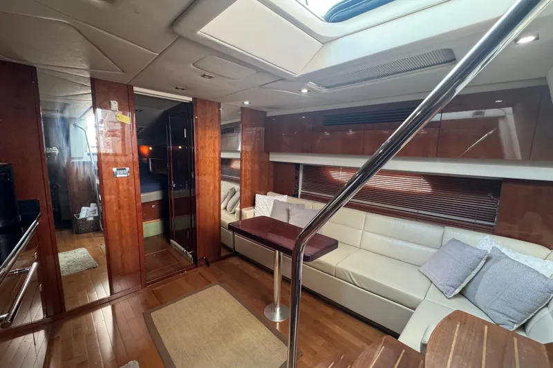 The Office Yacht Photos Pics Luxurious interior of 2011 Sea Ray 470 Sundancer yacht with elegant wood finishes.