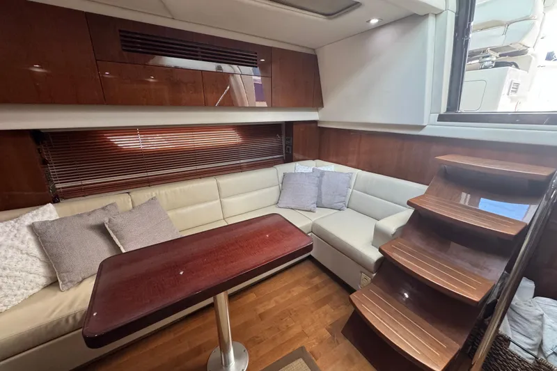 The Office Yacht Photos Pics Luxurious interior of 2011 Sea Ray 470 Sundancer yacht with elegant seating and wooden finishes.